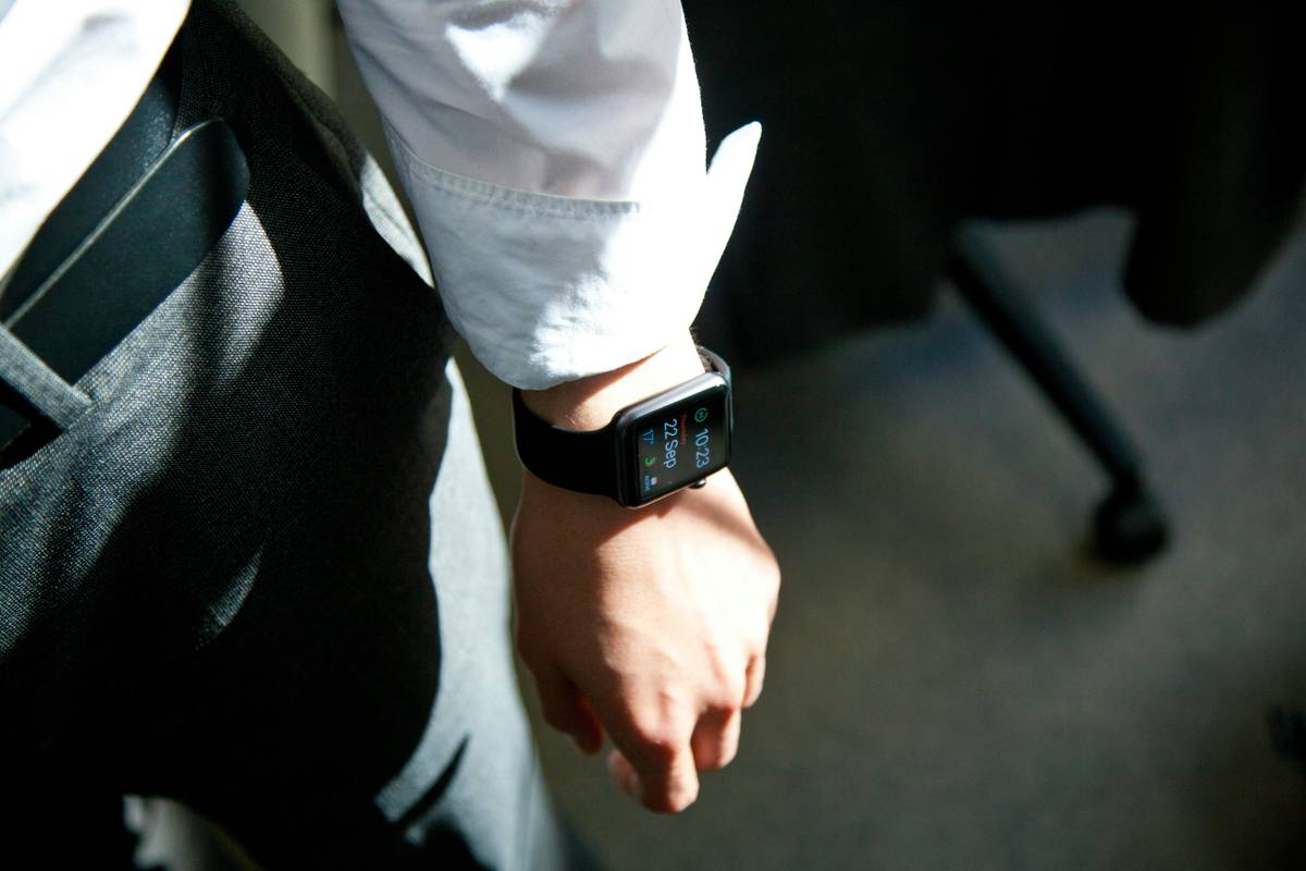 woman checking sleep schedule apple watch data on iPhone Health app